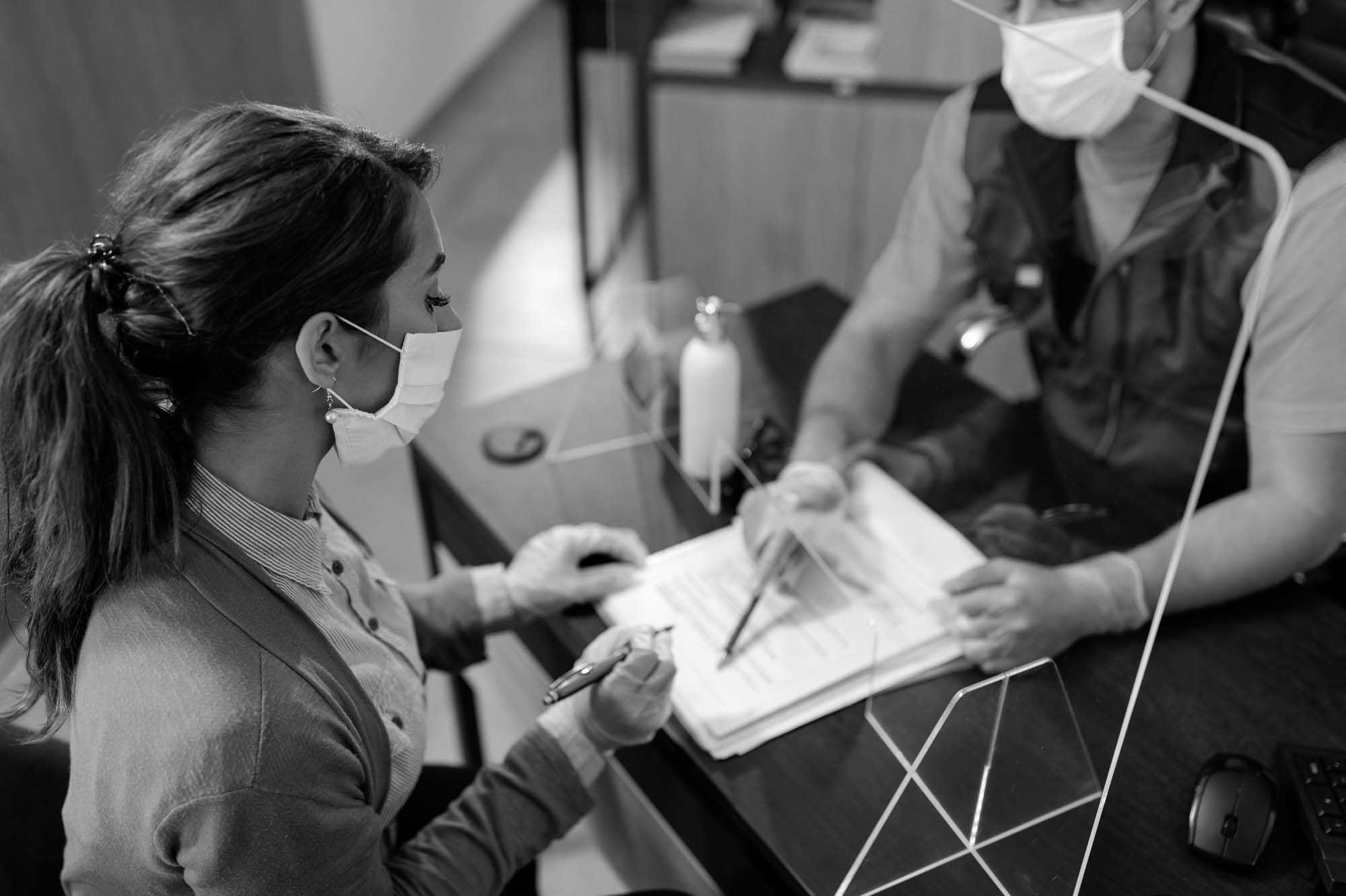 Contractor woman signing a document